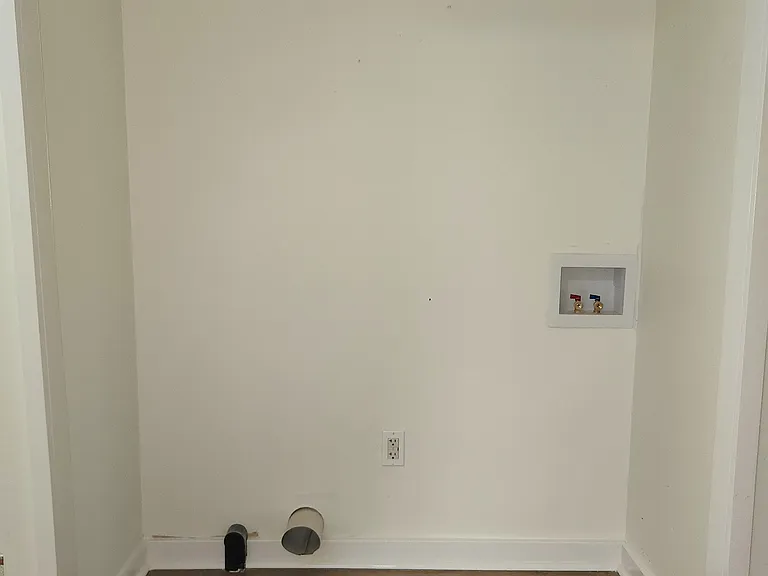 Laundry hook up in the hallway