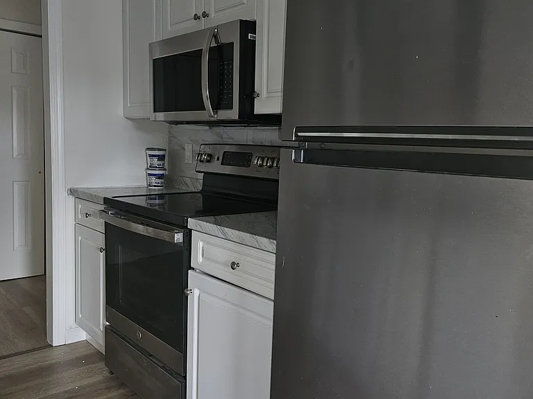 Kitchen with glass top stove and Microwave