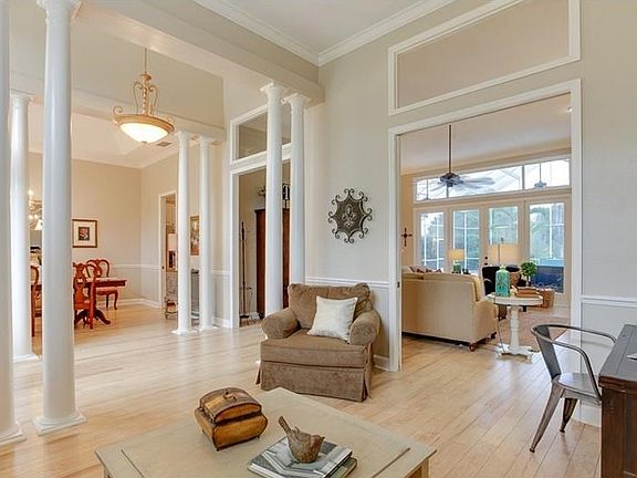 Open floor plan with volume ceilings and transom windows