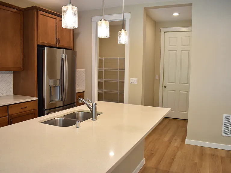 kitchen looking at garage door and pantry