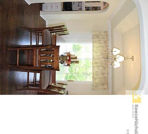 Dining room with attached built in desk and bar nook.