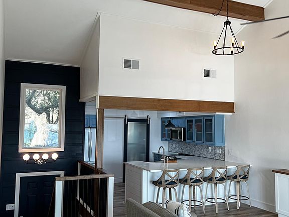 Extra storage in living and under peninsula Seating for 4 at the bar