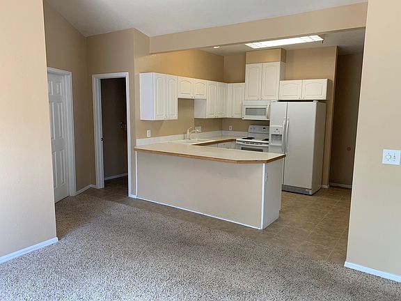 Nice kitchen with dish washer, microwave, refridgerator, and stove/oven.