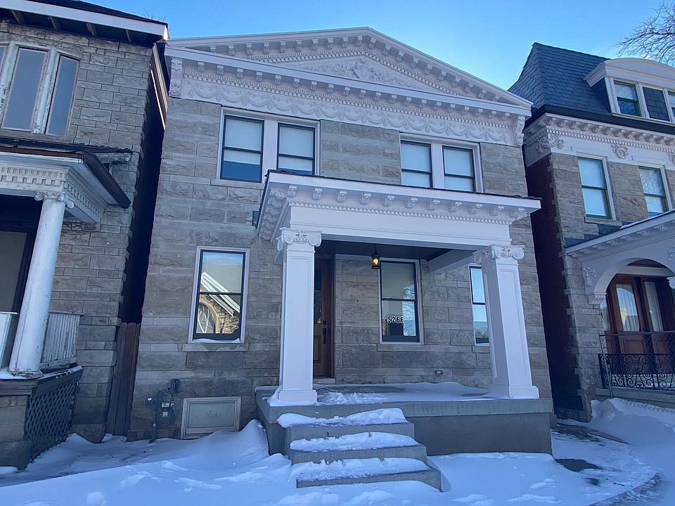 Rebuilt front porch with custom capitals, new roof, new concrete porch and stairs, new windows. Stained newly built front door.