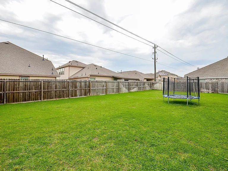 Backyard is VERY spacious. Picture features a mobile