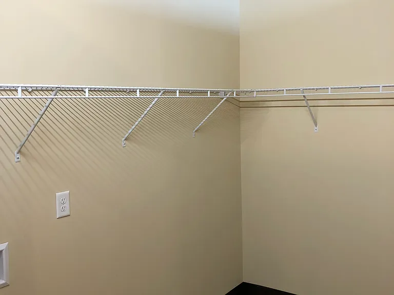 In-apartment storage unit with washer/dryer hookup.