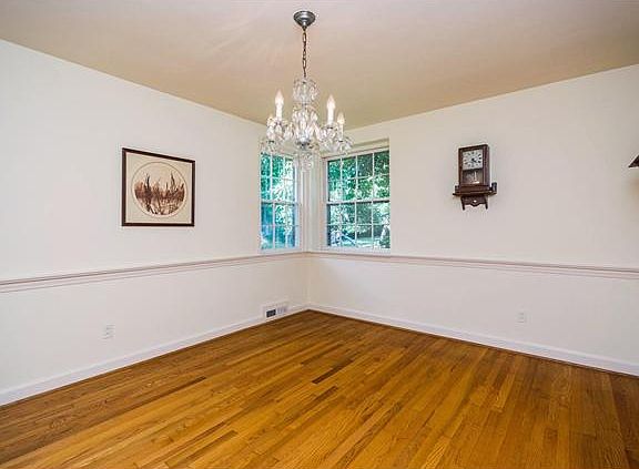 Formal dining room has a chair rail accent