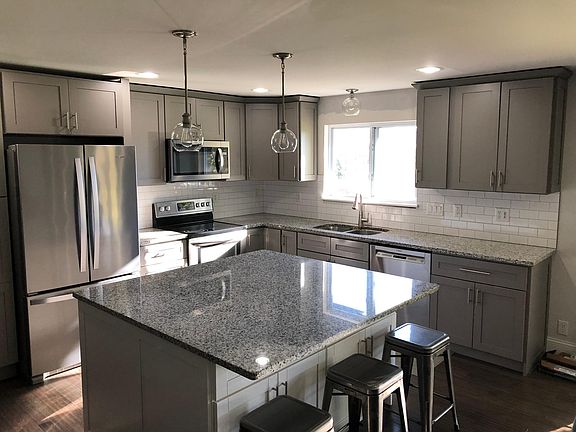 Kitchen showing great cabinet space, granite counter tops, large island, stainless steel appliances.