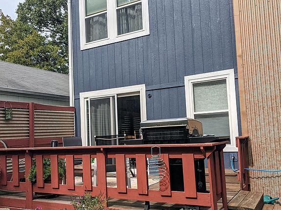 Large fenced backyard and deck.