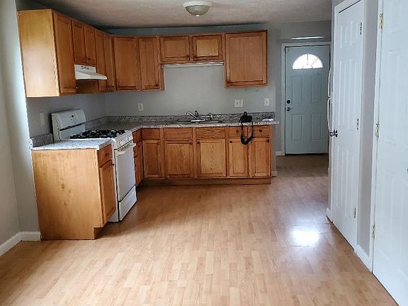 Well laid out kitchen with dining area full of sunlight