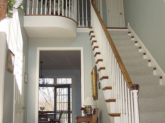 Center hall entry with beautiful updated stairway.