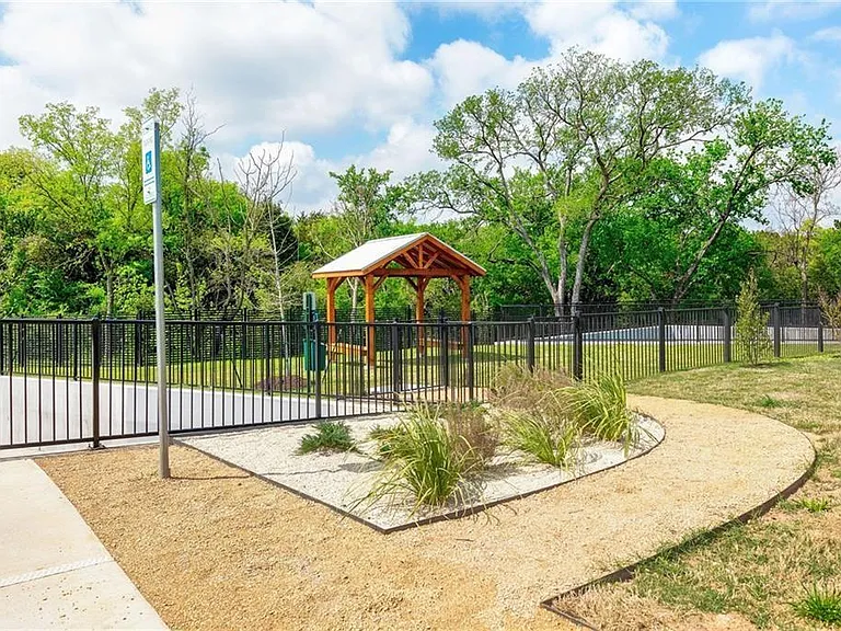 Community features fully fenced Dog park with Shaded seating area.
