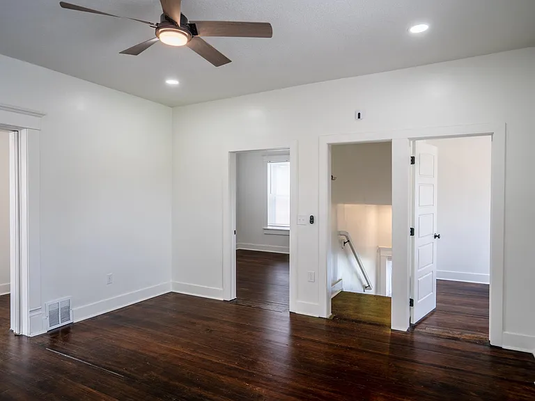 Bedroom 1 to the right, bedroom 2 to the left, stairway entry and living room pictured