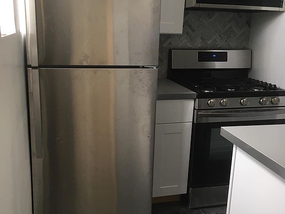 new kitchen with marble tile