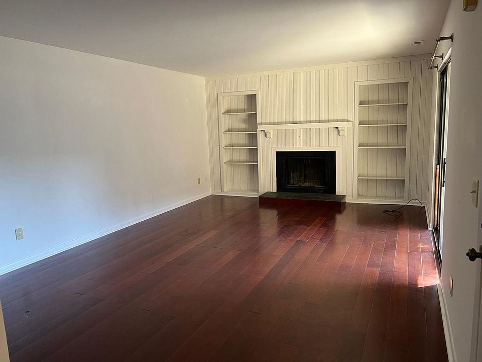 Living area with wood burning fireplace.