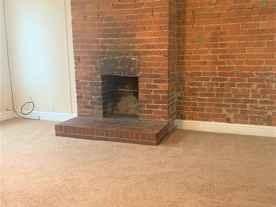 Living room with great exposed brick accent wall