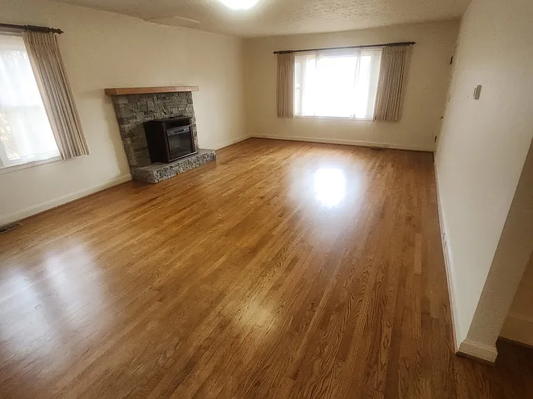 large living area with electric fireplace.
house is vacant ready to move-in.
