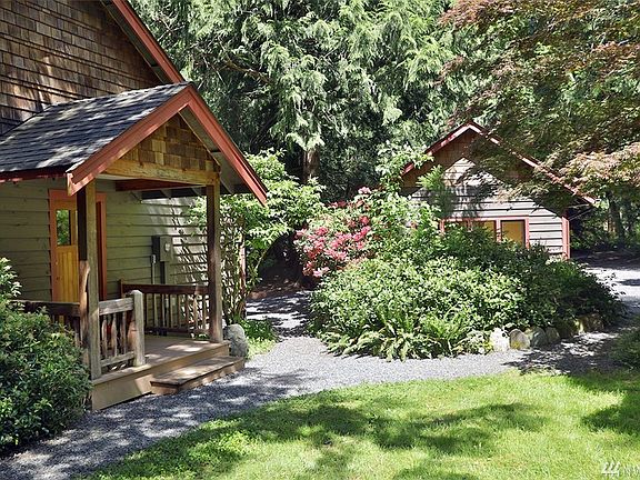 To the left is the main entrance (east facing) and straight ahead is the Guest Cottage with parking area (enough for several cars) to the right of the cottage. 