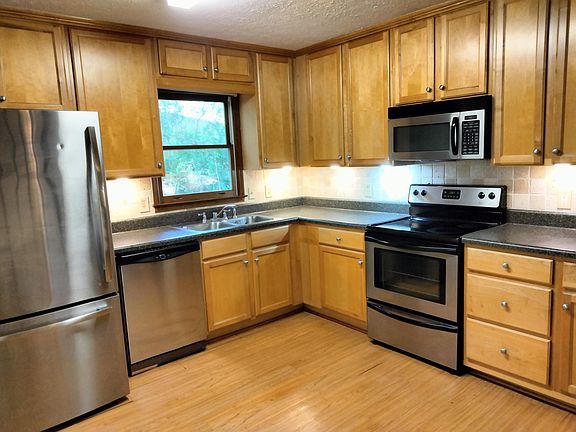 Updated Kitchen with stainless steel appliances. Includes refrigerator, dishwasher, stove, & microwave
