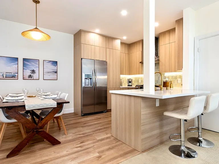 Fully remodeled kitchen with breakfast bar seating.