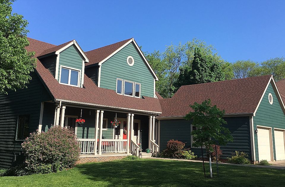 Outside, with new siding.