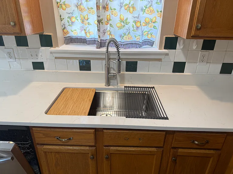 New Sink includes a Roll-up drying rack and Bamboo cutting board