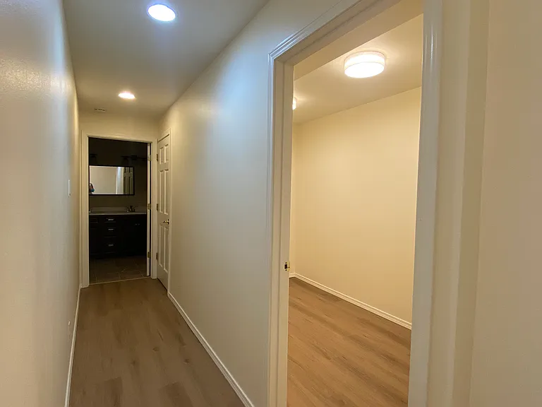 hallway to bathroom- spacious storage room