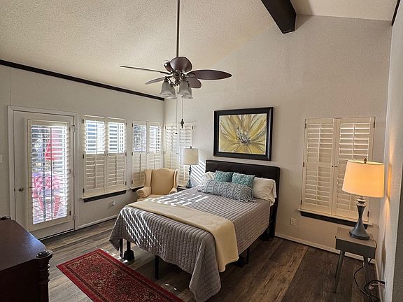 Comfortable and Lovely Master Bedroom with Outdoor Access and Plantation Shutter