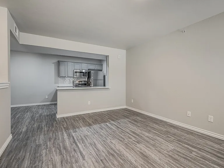 Experience the elegance of this open-concept kitchen and living space, perfect for contemporary living.
