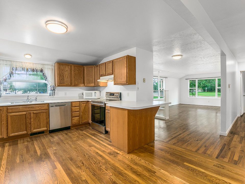 Kitchen area, living room and hallway.