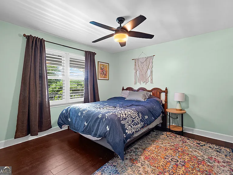 First floor bedroom with closet and private access to shared full bath