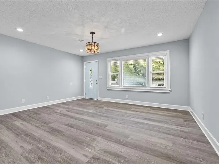 Living room and front entrance door.