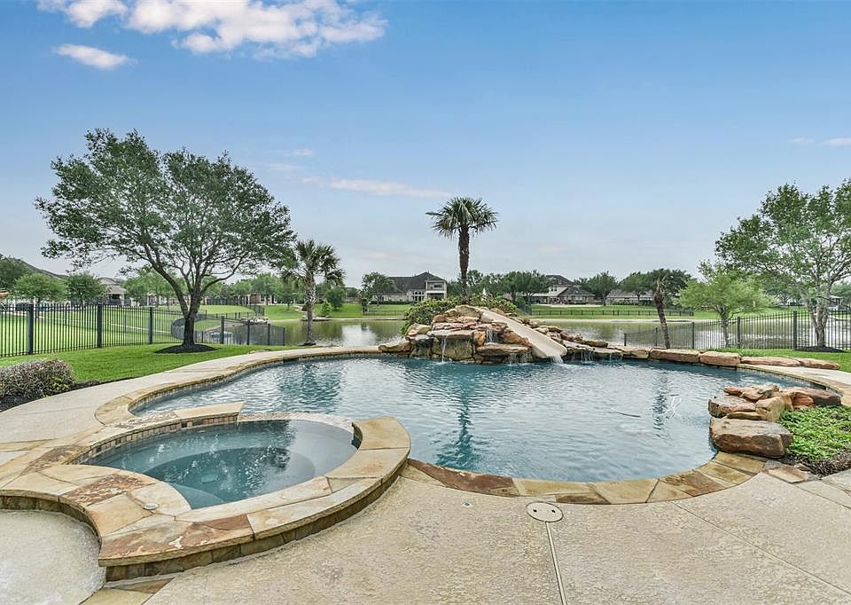 WOWZA! This view and backyard resort style living can be yours at 1919 Anchor Lakes in the much sought after Grayson Lakes neighborhood in Katy