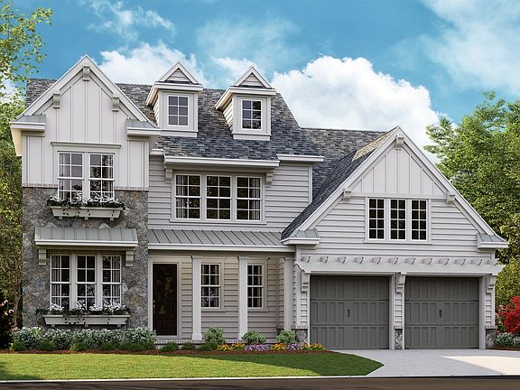 Huntley - American Cottage a 2-Car Front Load Garage Note Renderings may show optional featur