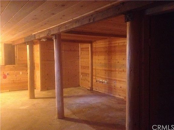 lower area of house. accesible by inside stairway and outside entrance