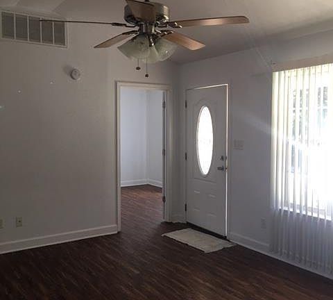 Living room w/vaulted ceiling going into master