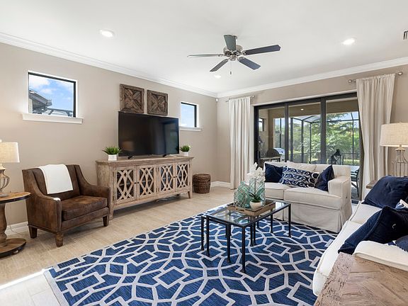Model Representation Inviting gathering room with a sliding glass door to lanai