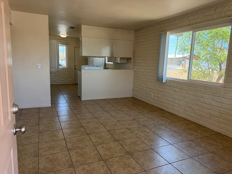 Living room with kitchen in background