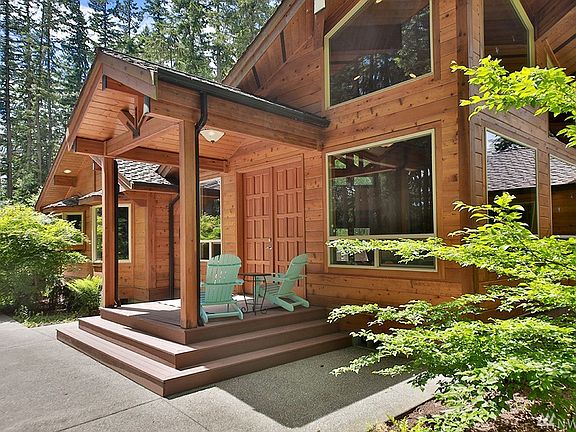 Lovely covered front porch welcomes you to this exquisite Pan Abode.