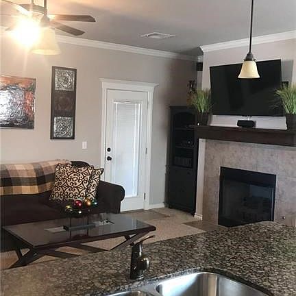 You can still be part of the activity and conversation from the living area as you put on those finishing touches to your meal. Don't forget about the wonderful stainless steel double sink and granite countertops for easy cleanup!