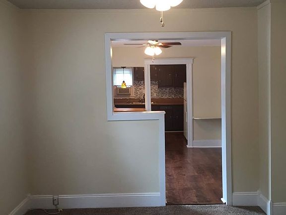 Living room looking into dining room and kitchen