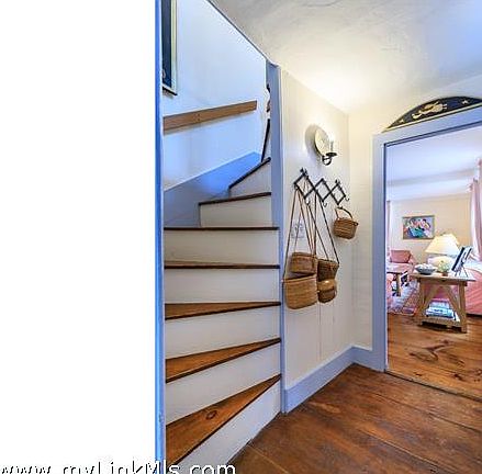 Front foyer with stairs to the master bedroom and beyond