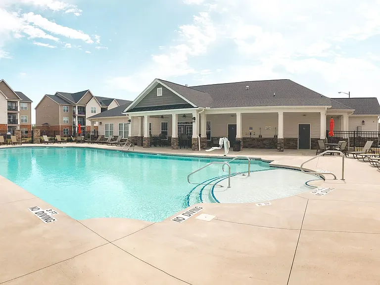The seasonal saltwater pool is located at the center of the property near The Clubhouse.