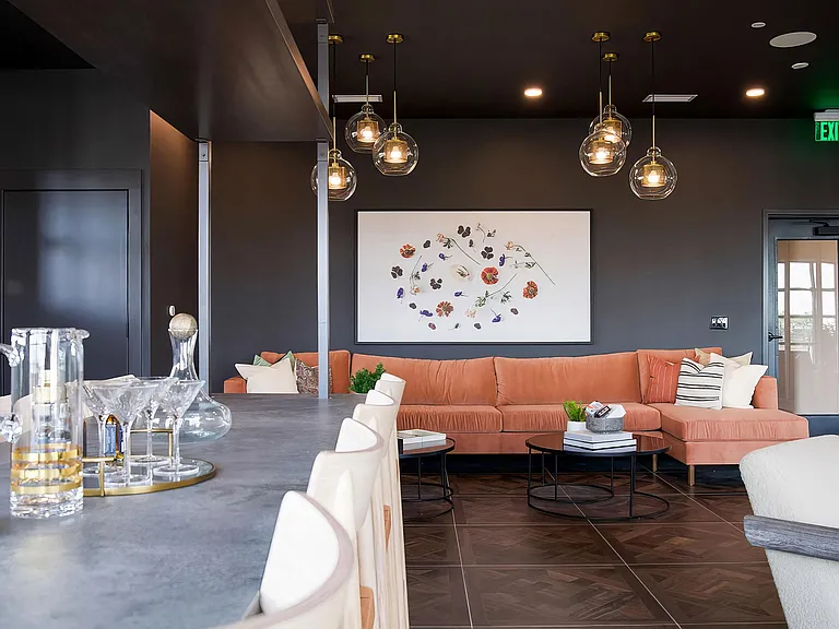 Modern bar-style seating area with comfy sofa and delicate lighting