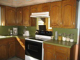 Kitchen features tile floors & recent range & dishwasher