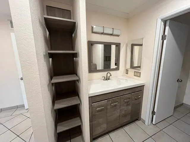 Primary bedroom vanity & linen closet