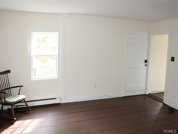 Living room with front entrance.