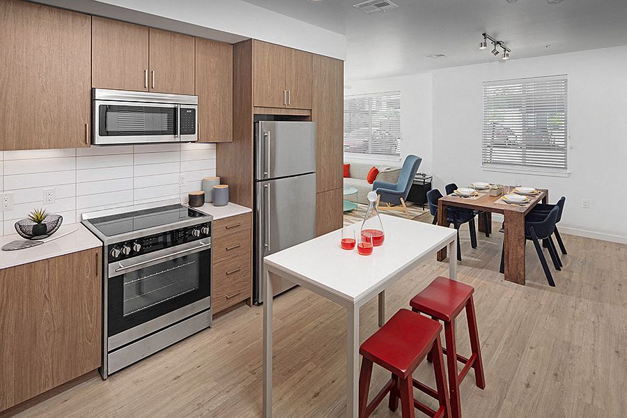 Luxury vinyl plank flooring is featured throughout all entry, kitchen, living/dining and baths