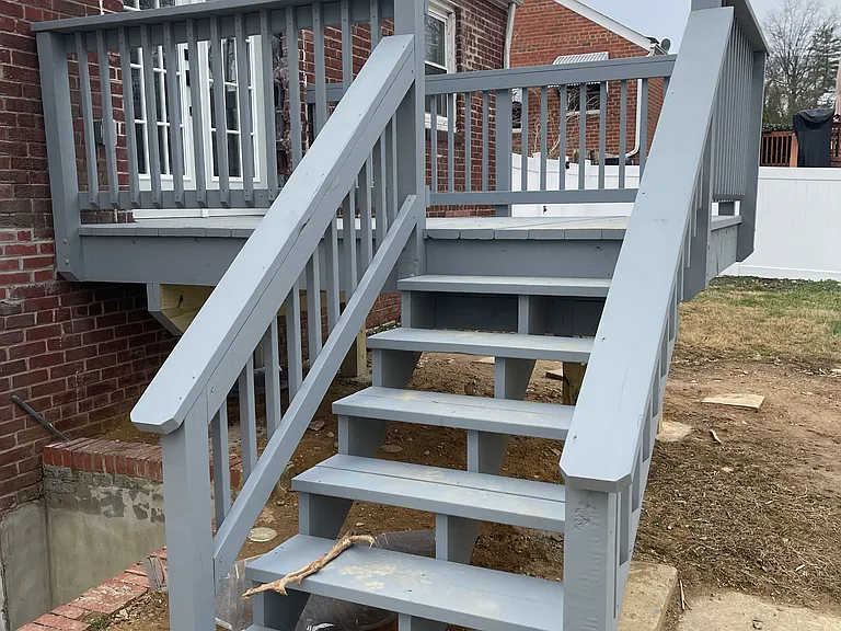The deck seamlessly extends your living space outdoors, creating the perfect setting for summer cookouts, evening gatherings, and easy access to the generous fenced yard.