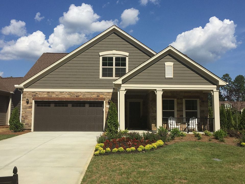 Exterior photo of a Portico home at The Courtyards at O Kelly Chapel in Cary, North Carolina.